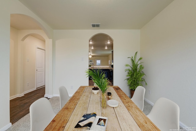 dining room with ceiling fan and wood-type flooring