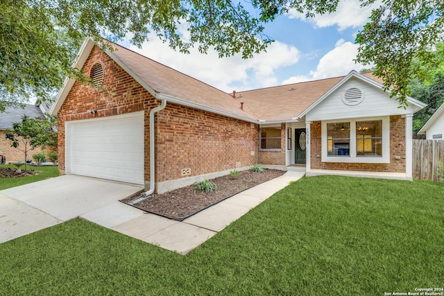 ranch-style home with a garage and a front yard