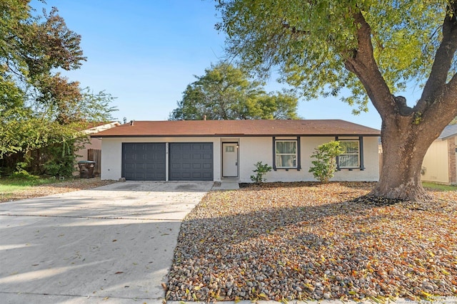 ranch-style home featuring a garage