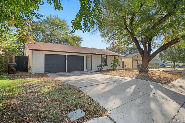 single story home featuring a garage