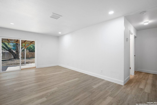 unfurnished room with light hardwood / wood-style floors