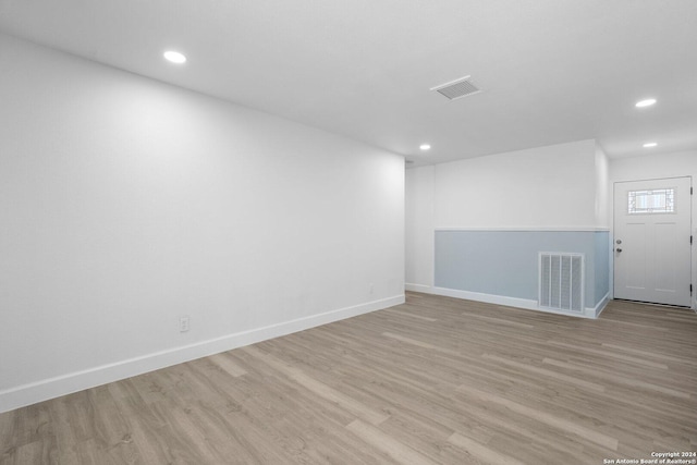 unfurnished room featuring light hardwood / wood-style floors