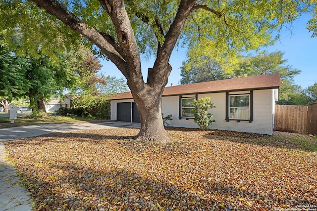 single story home with a garage