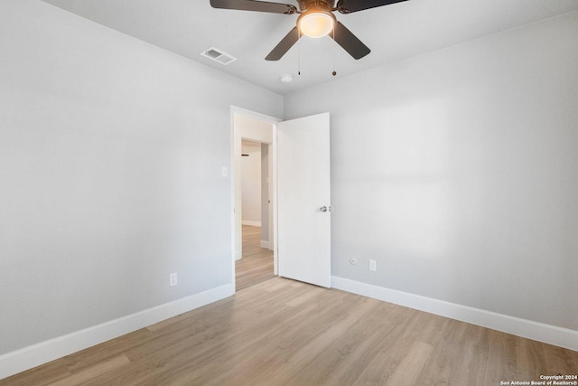 unfurnished room featuring ceiling fan and light hardwood / wood-style floors