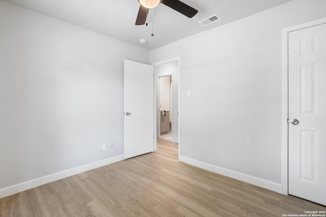 unfurnished bedroom with ceiling fan and light hardwood / wood-style flooring