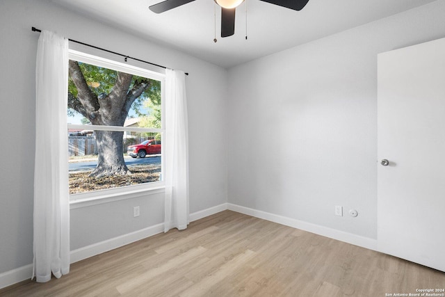 unfurnished room with ceiling fan and light hardwood / wood-style floors