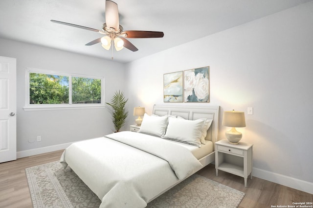 bedroom featuring ceiling fan and light hardwood / wood-style flooring