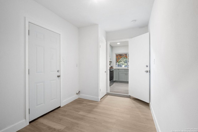 hallway featuring light wood-type flooring