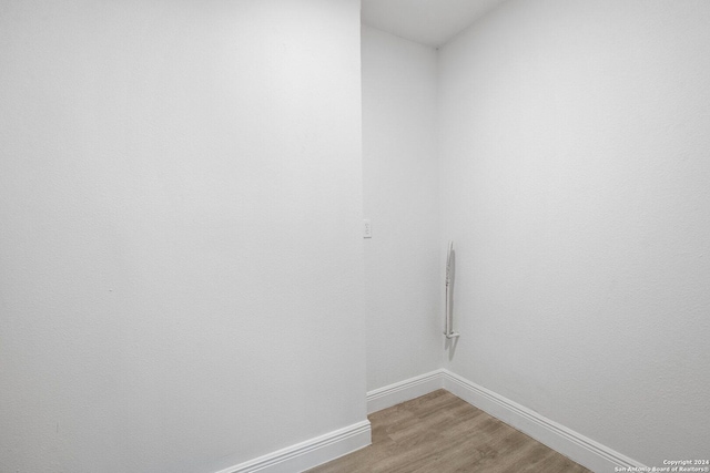 laundry area featuring hardwood / wood-style floors