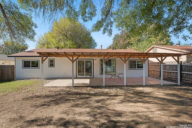 back of house featuring a pergola and a patio area