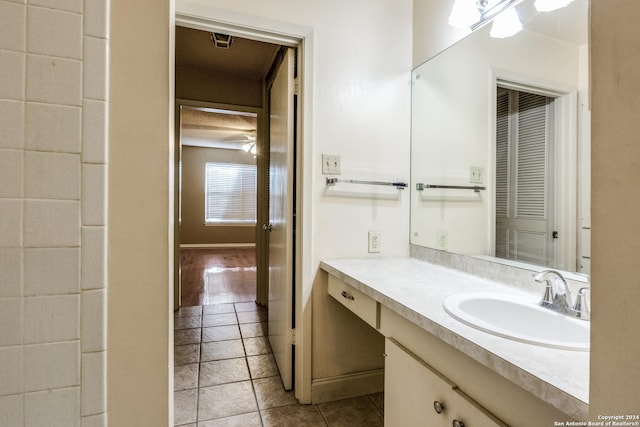 bathroom featuring tile patterned flooring and vanity