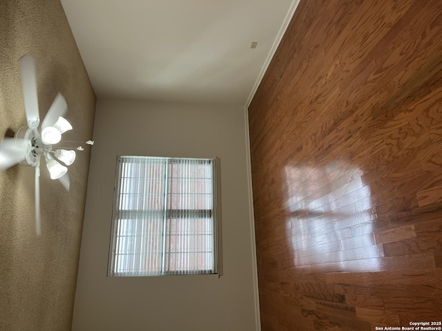 unfurnished room featuring wood walls