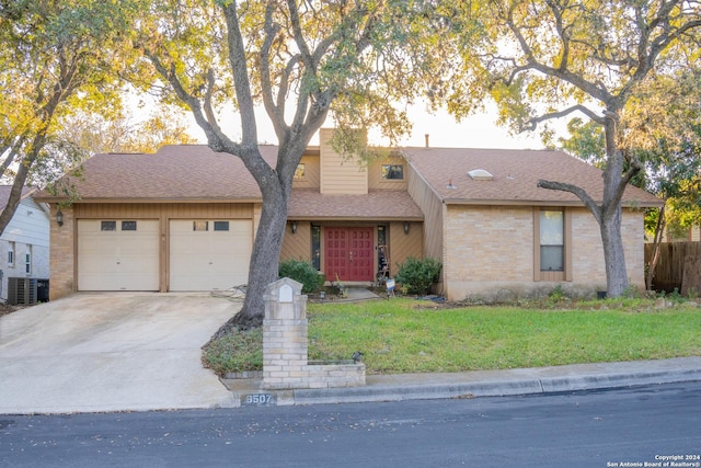 ranch-style home with a garage, central air condition unit, and a front lawn