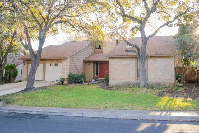 single story home featuring a garage and a front yard