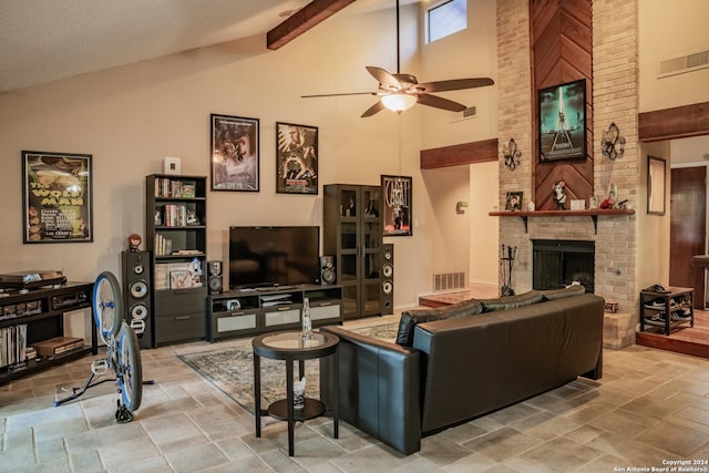 living room with a fireplace, high vaulted ceiling, ceiling fan, and beamed ceiling