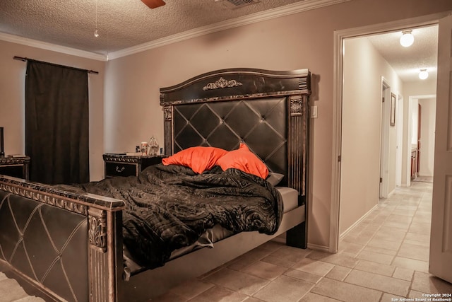 bedroom with crown molding and a textured ceiling