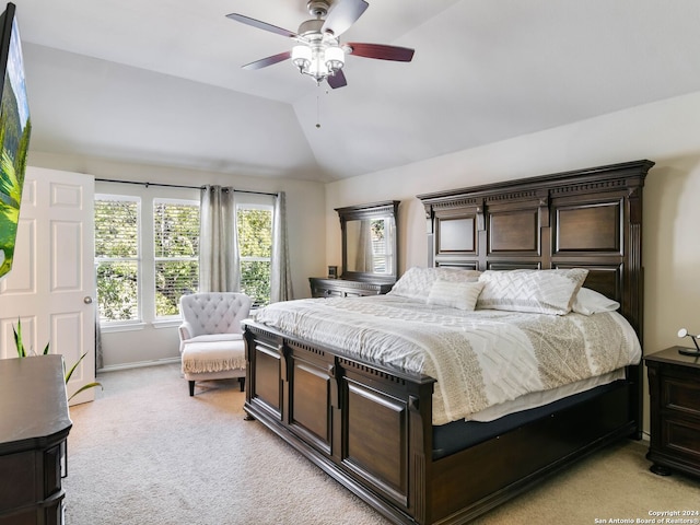 carpeted bedroom featuring ceiling fan and lofted ceiling