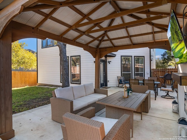 view of patio with outdoor lounge area and a gazebo