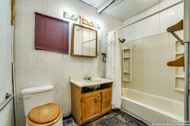 full bathroom featuring vanity, shower / bath combination with curtain, toilet, and tile walls