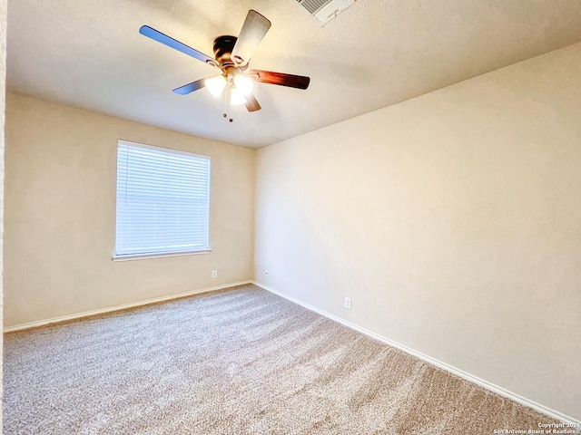 empty room with carpet floors and ceiling fan