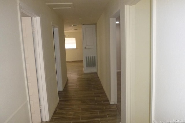 hallway featuring dark wood-type flooring