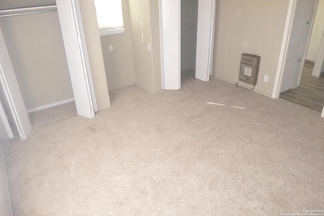 unfurnished bedroom featuring light colored carpet