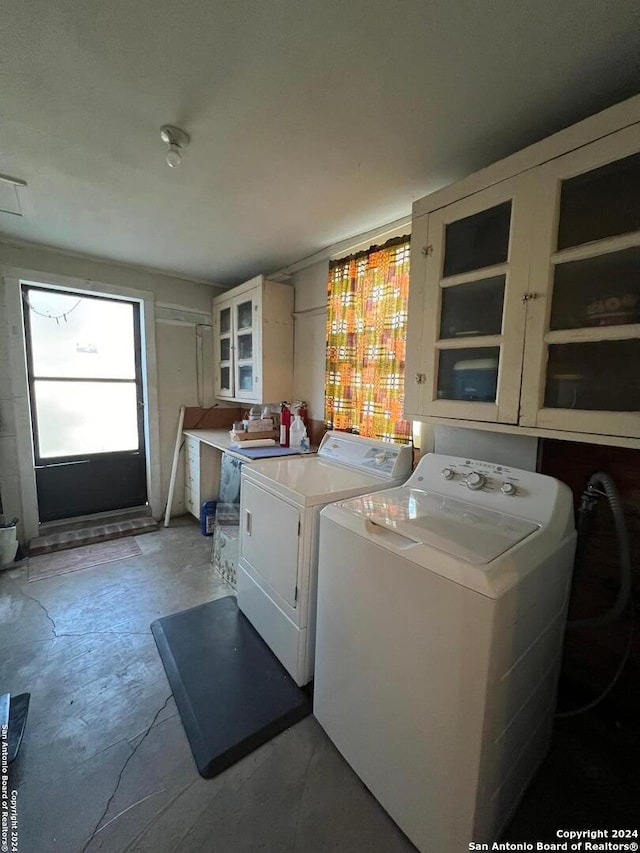 clothes washing area featuring washing machine and clothes dryer