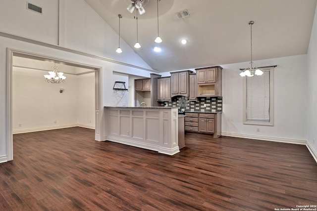 kitchen featuring dark hardwood / wood-style flooring, hanging light fixtures, and high vaulted ceiling