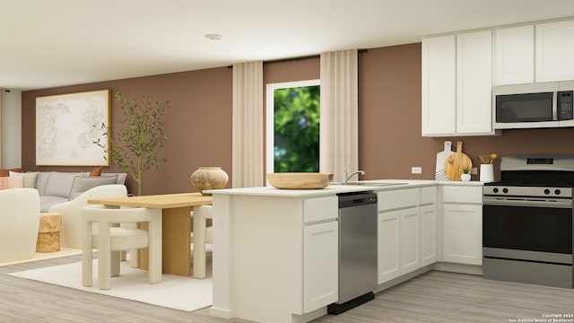 kitchen with kitchen peninsula, stainless steel appliances, sink, light hardwood / wood-style flooring, and white cabinetry