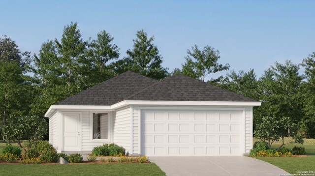 exterior space featuring a front lawn and a garage