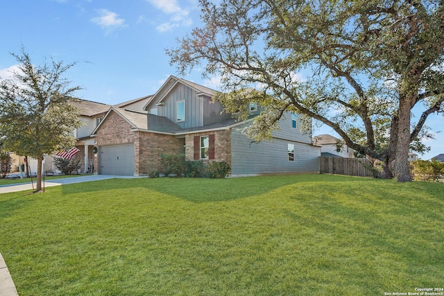 view of front of property with a garage and a front lawn