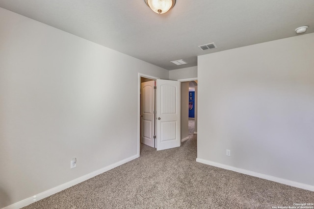 unfurnished room featuring carpet flooring