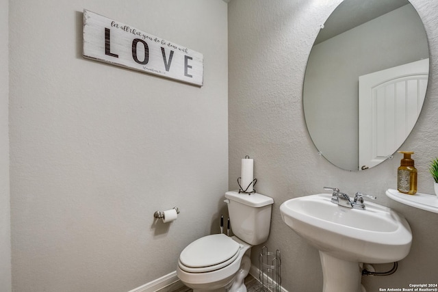 bathroom featuring toilet