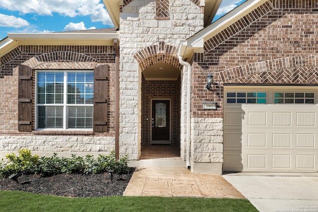 doorway to property featuring a garage