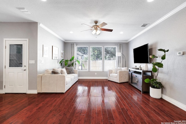 unfurnished living room with a textured ceiling, dark hardwood / wood-style floors, ceiling fan, and crown molding