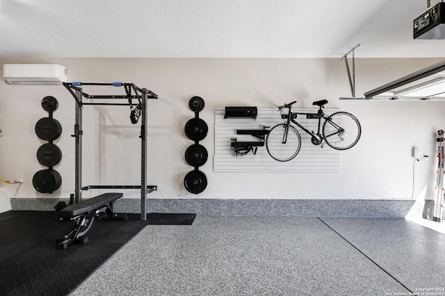 workout room featuring an AC wall unit