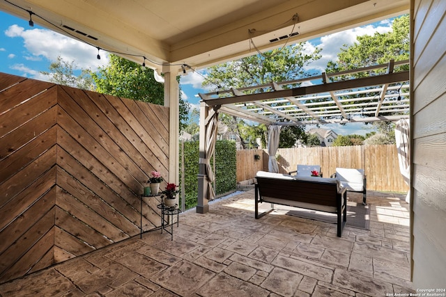 view of patio with an outdoor living space and a pergola