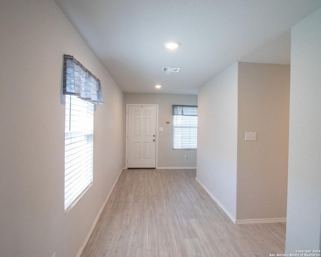 corridor featuring light hardwood / wood-style flooring