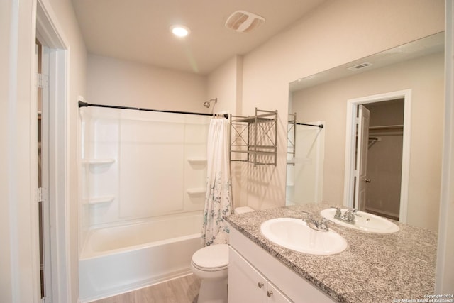 full bathroom with hardwood / wood-style flooring, vanity, toilet, and shower / bathtub combination with curtain