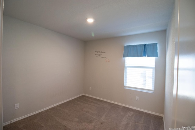 spare room featuring carpet flooring