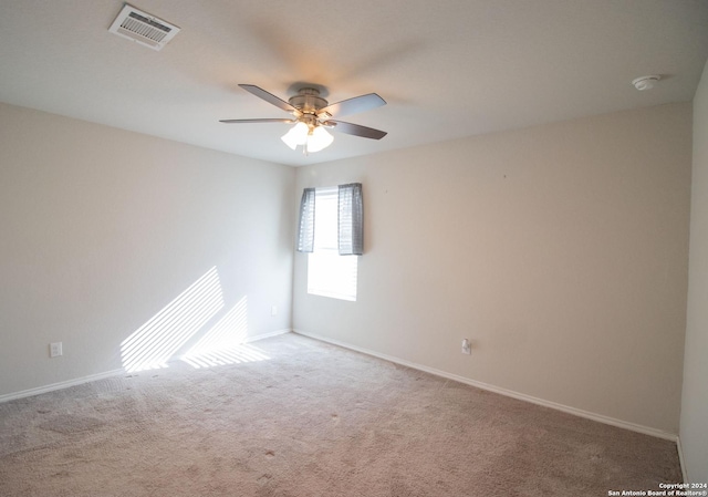 empty room featuring carpet flooring and ceiling fan