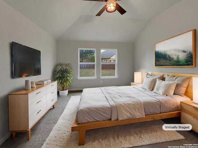 carpeted bedroom featuring ceiling fan and vaulted ceiling