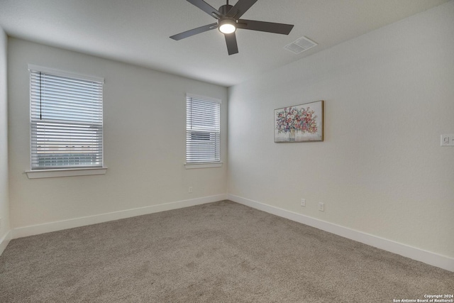 unfurnished room featuring ceiling fan, a healthy amount of sunlight, and carpet flooring