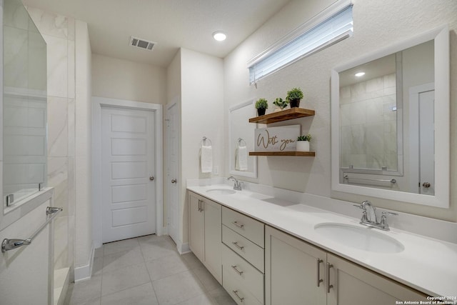 bathroom featuring tile patterned flooring and vanity