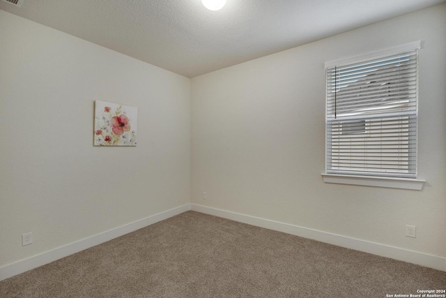 empty room with carpet flooring