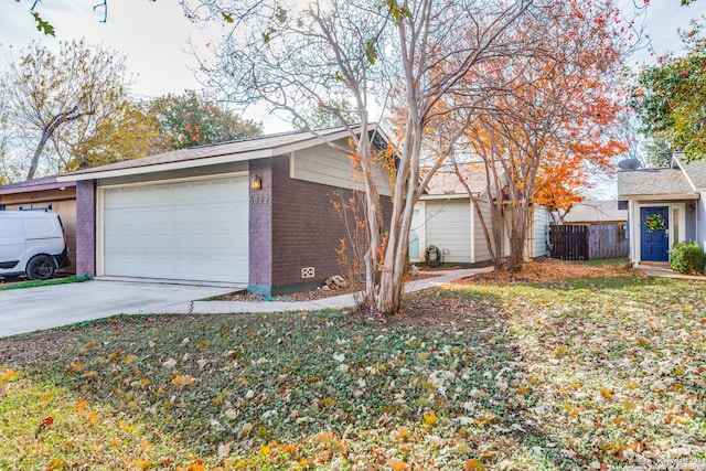 ranch-style home featuring a garage