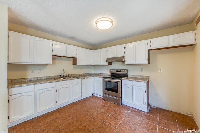 kitchen with a textured ceiling, stainless steel electric range, white cabinetry, and sink