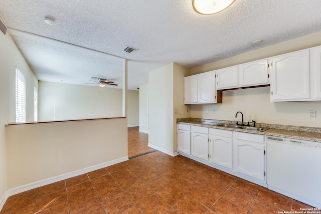 kitchen featuring white dishwasher, sink, ceiling fan, a textured ceiling, and white cabinetry