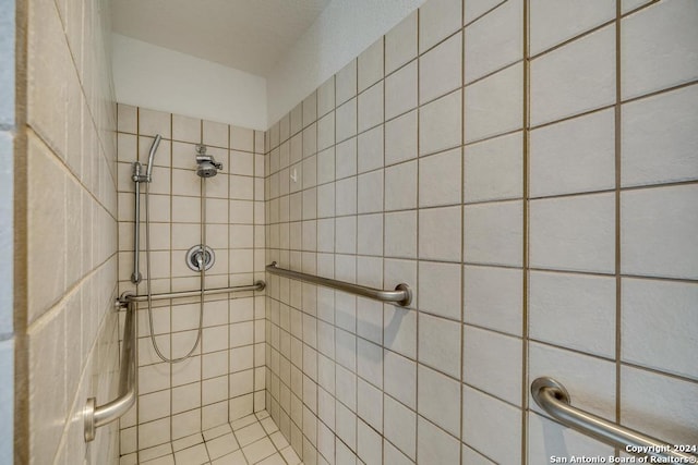 bathroom with tiled shower