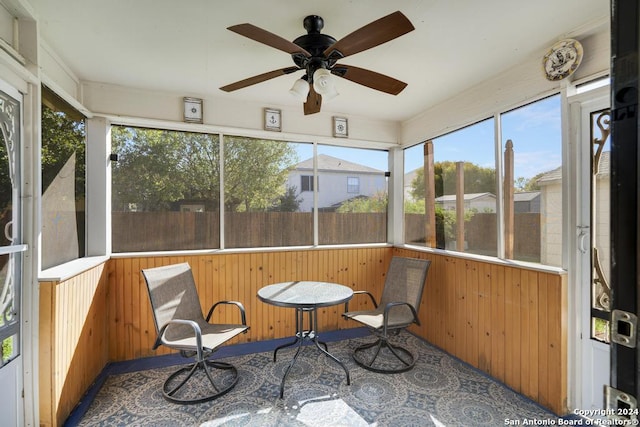 sunroom / solarium featuring ceiling fan